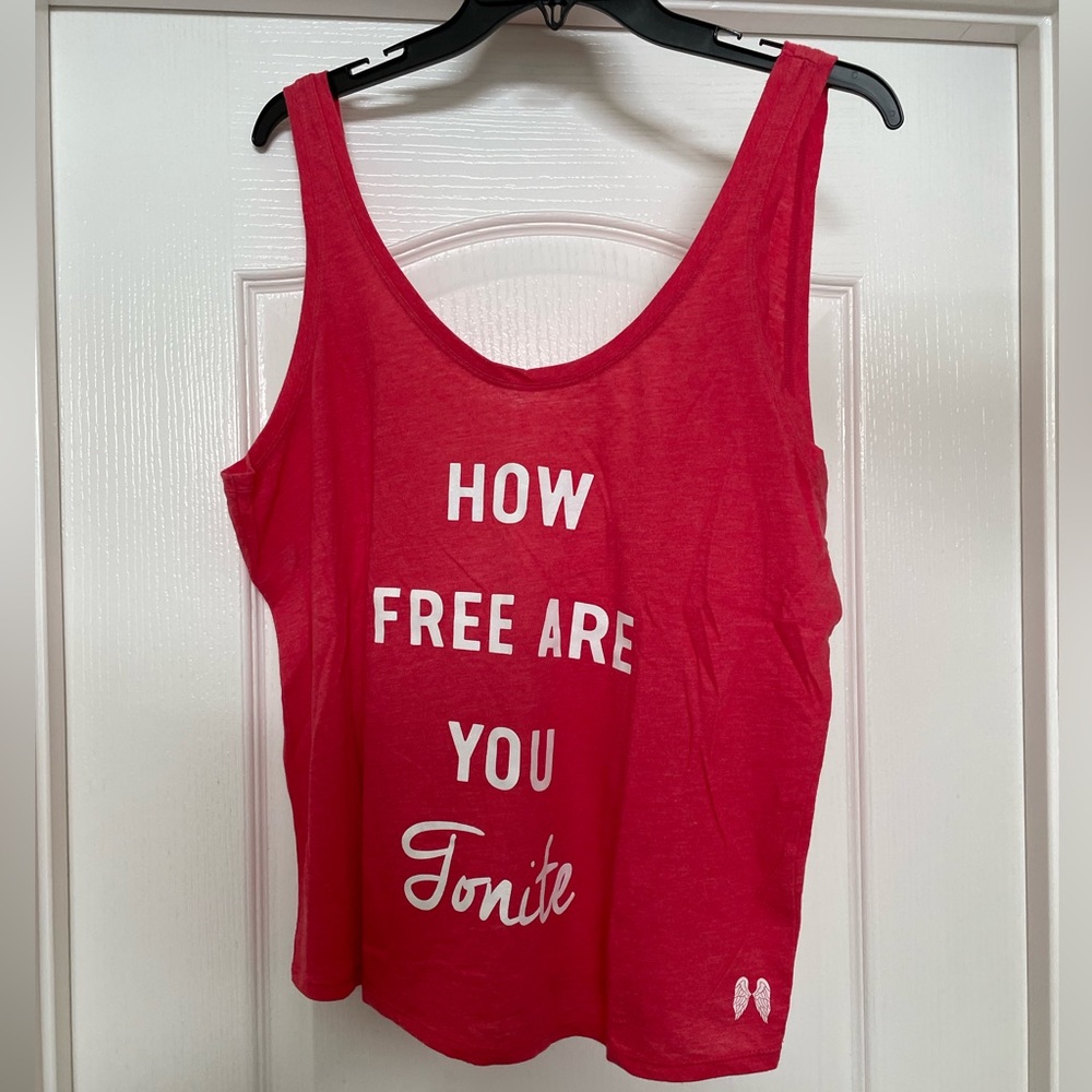 Victoria’s Secret tank top size Large in red with “HOW FREE ARE YOU…”🎉Host Pick🎉